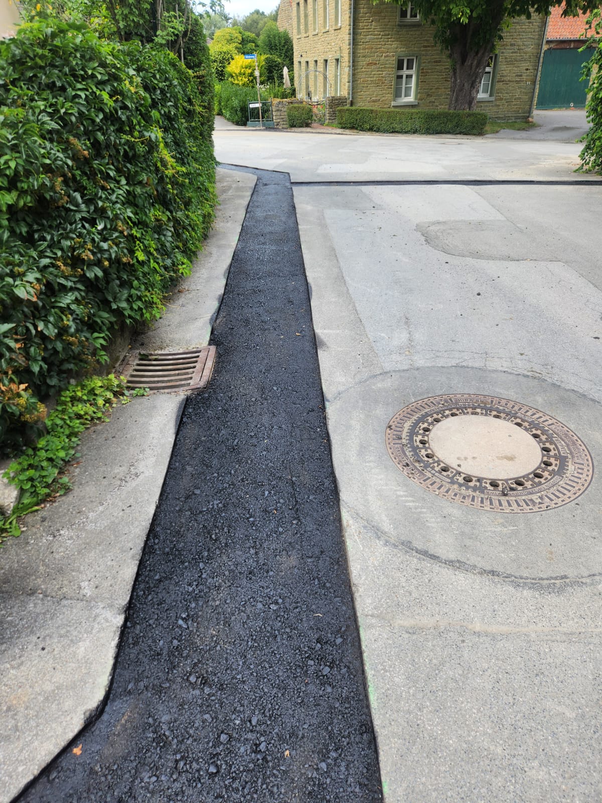 Asphalt Kanalarbeiten